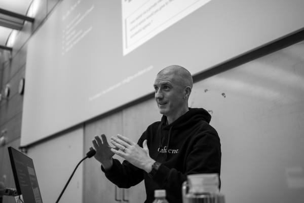 Mark Conroy keynoting at Drupal Camp England 2025, talking about being a funded open source developer.